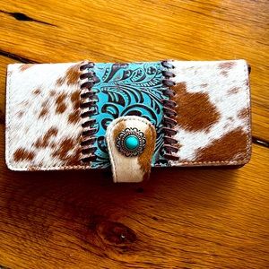 Ladies cow print wallet w/ fur and leather snap closure